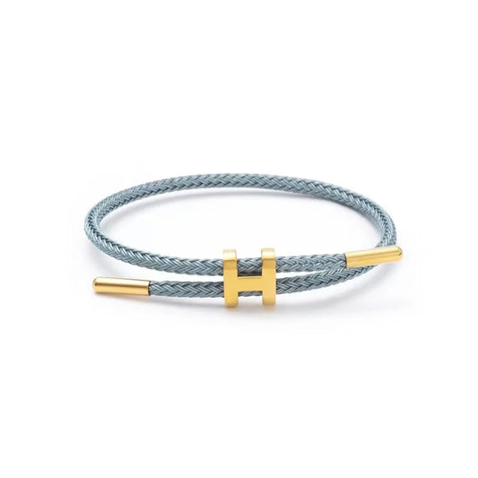 Bracelet tressé réglable avec charme inox – Bijou élégant et empilable pour femme